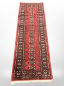 A Lahore Bokhara runner, Pakistan, 193cm x 66cm.