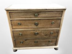 A 19th century Scandinavian oak and pine four drawer chest on bun feet, 98cm x 51cm x 92cm.