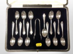 A George V set of twelve silver teaspoons and sugar tongs in case, Cooper Brothers & Sons Ltd,
