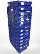 Twelve stackable plastic storage boxes with folding lids,