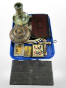 A group of reproduction religious icons, a crucifix, a mother-of-pearl-inlaid charger,