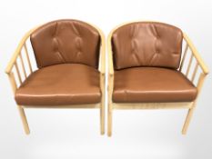 A pair of Danish oak and tan buttoned leather armchairs,