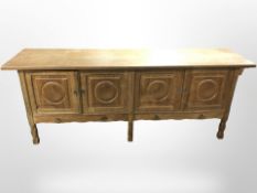 A 20th-century Danish oak four-door low sideboard, 200cm long x 51cm deep x 78cm high.