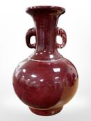 A Chinese sang de boeuf vase with elephant handles, height 32cm.