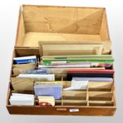 A wooden stationery box and contents.