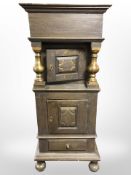 A 19th-century Scandinavian stained pine cabinet with brass columns,