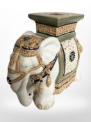 A ceramic elephant plant stand, height 43cm.