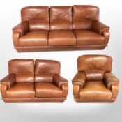 A stitched tan leather three piece lounge suite comprising of three seater settee, width 210 cm,