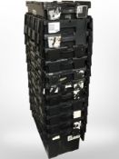Twelve stackable plastic storage boxes with folding lids,