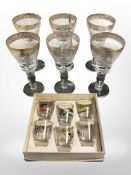 A set of six etched and gilt wine glasses, height 17.
