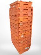 Twelve stackable plastic storage boxes with folding lids,