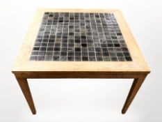 A 20th-century Danish teak tile-inset coffee table, 73cm square x 52cm high.
