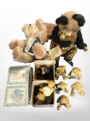 An English Teddy Bear Company teddy bear, plus another, and several R&R teddy bear ornaments.