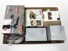 A group of home wares including pressure cooker, apothecary cosmetics basket, diffusors, etc.