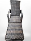 A woven plastic garden lounger, length approx.