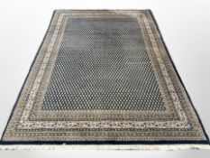 A Bidjar carpet, North-West Iran, the dense indigo field with repeat boteh motif,