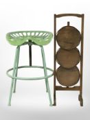 A tractor seat stool and an oak cake stand
