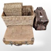 A large wicker hamper, a basket, leather suitcase and a further case,