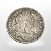 A William III silver half crown.
