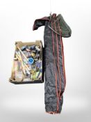A group of modern fishing rods, landing net, box containing reels, lures,