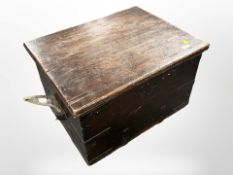A 19th century cedar wood and metal bound storage box with twin rope handles,