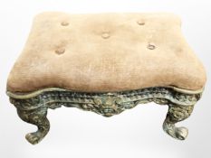 An ornate cast brass and velvet stool, width 32cm.