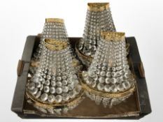 A set of four contemporary crystal lustre wall lights,