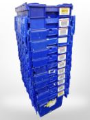 Twelve stackable plastic storage boxes with folding lids,