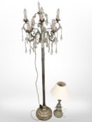 A silvered metal standard lamp in the form of a chandelier and a table lamp