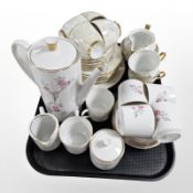 A 15 piece Bavarian porcelain coffee set and a 21 piece Czechoslovakian lustre tea set.