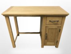 A modern oak single pedestal desk,