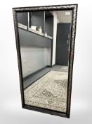 A contemporary mirror, 66 cm x 125 cm.