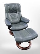A Norwegian Ekornes Stressless dark green leather armchair and matching foot stool