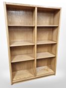 An oak effect open bookcase with adjustable shelves,