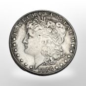 An 1888 silver U.S.A dollar.