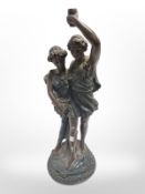 A resin figural lamp base, height 40cm, and a decorative gilt wall plaque.