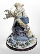 An Alice in Wonderland Bradford Exchange cuckoo clock and a Bradford Exchange Thomas Kinkade