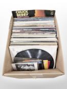 A quantity of vinyl LP records, including The Police, John Denver, Bruce Springsteen,