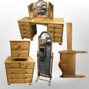 A group of modern pine bedroom furniture comprising dressing table, five drawer chest,