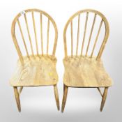 A pair of Ercol elm and beech spindle back dining chairs