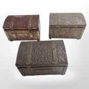 Three copper and brass tea caddies, in the form of trunks, largest 15.5cm wide.