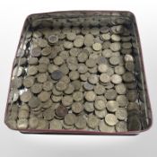 A large quantity of three pence pieces.