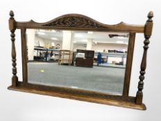 An Old Charm carved oak over mantel mirror,