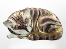 A Royal Crown Derby sleeping cat paperweight, with gold stopper, width 8cm.