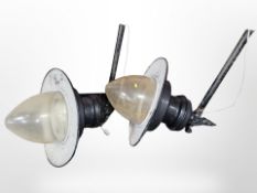 A pair of large painted metal wall lights with perspex shades,
