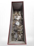 A box of mixed British and world coins.