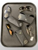 A group of sunglasses, to include, Emporio Armani and 3 pairs of Rayban.