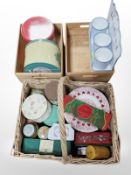 A wicker hamper and two pine crates containing assorted tins.