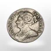 A Queen Anne shilling.