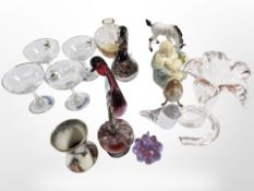 A set of four Babycham glasses, a Caithness glass vase, further glass paperweights,